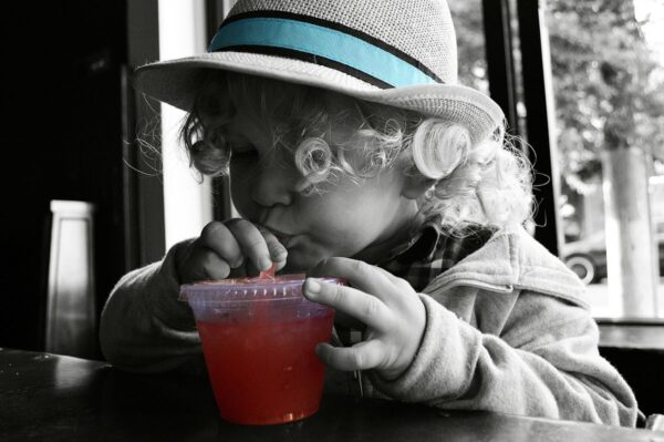 kid drinking from cup